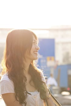 Asian woman similing under sunlight