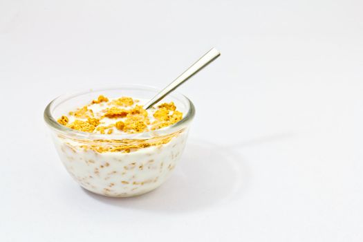 Corn flakes and milk in a bowl-healthy light breakfast