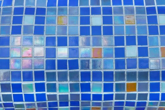 Fragment of colorful mosaics with small square tiles on the toroidal surface. Done mainly in colors of blue