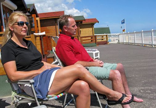 A couple relaxing near the beach.