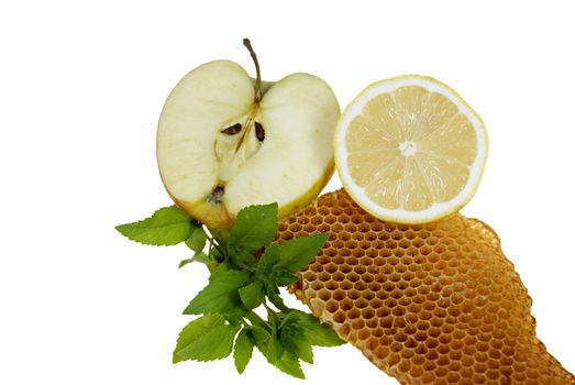 fruits with mint and honeycomb isolated on white background