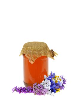honey in jar and flowers isolated on white background