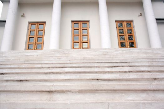 Marble stairs leading to three doors