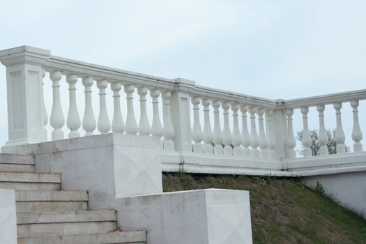 A fragment of the marble staircase with marble banister.