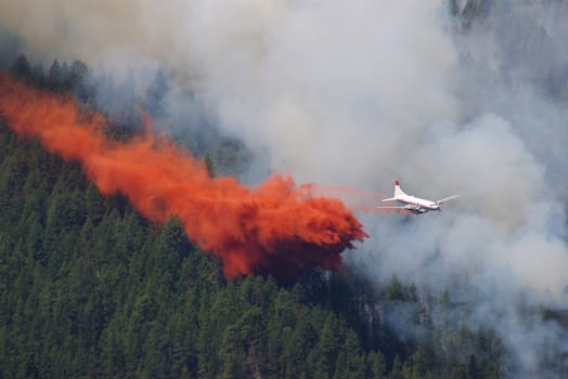 Forest fire fighting in the mountains using an airplane