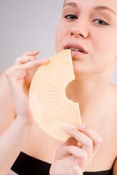 Young goodlooking woman with a ice cream on her head