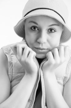 Young good looking girl with a hatlooking into the lens