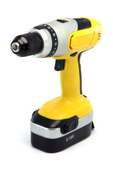 yellow rechargeable drill isolated on white background industrial tools