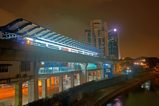 Transportation architecture of station in night with river in Kuala Lumpur, Malaysia, Asia.