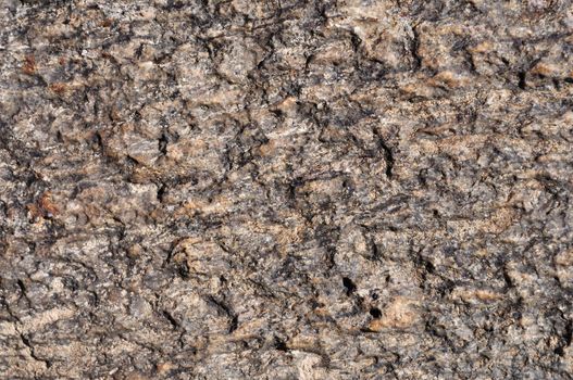 Fragment of natural brown stone surface texture