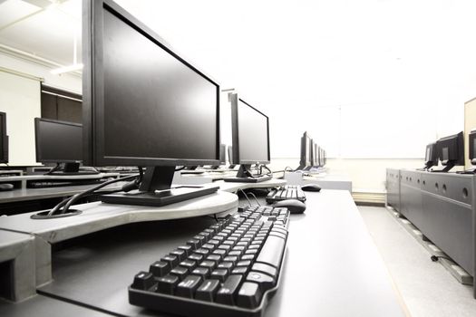 workplace room with computers in row 