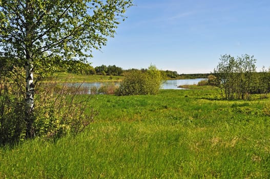 Country landscape with lake and meadow, Russia