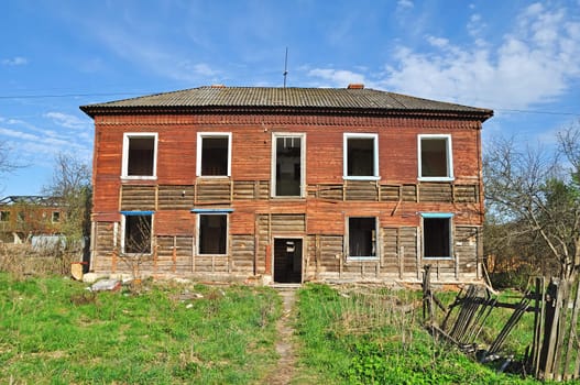 Facade of old destroyed wooden house