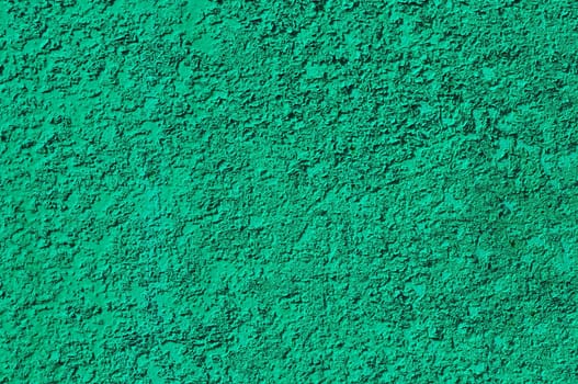 Fragment of rough green colored metal surface