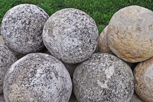 Collection of old stone cannon balls in ancient russian Goritsky monastery of Pereslavl-Zalessky
