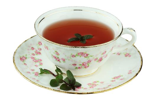 Chocolate peppermint tea in an antique tea cup isolated on a white background with clipping path.
