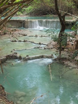 Small waterfall with emerald color water on the way of Wang Kan Lueang Waterfall, Tha Luang, Lop Buri, Thailand