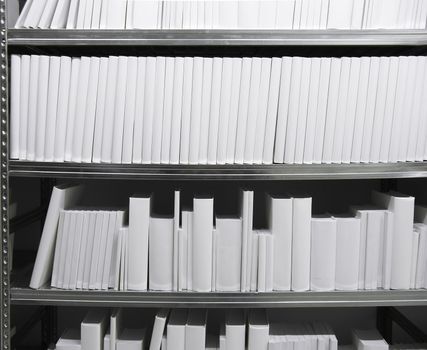 Rear view of white books in a shelf