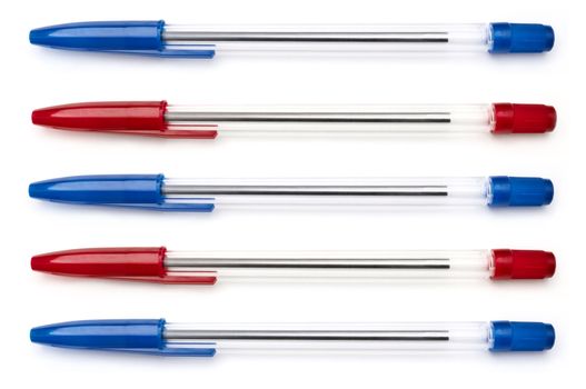 A selection of blue and red writing pens arranged horizontally over white