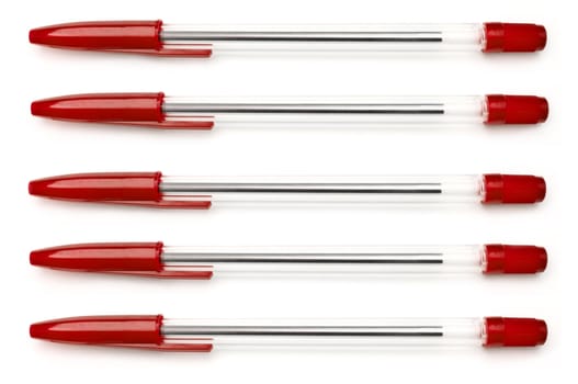 Five red writing pens arranged horizontally over white