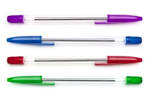 Four plastic writing pens in a variety of colours arranged horizontally and over white