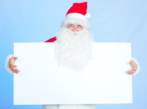 Xmas background: Santa, gifts, kid, happy holiday. In studio
