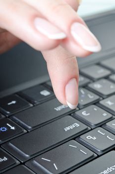 women's fingers over the keyboard laptop