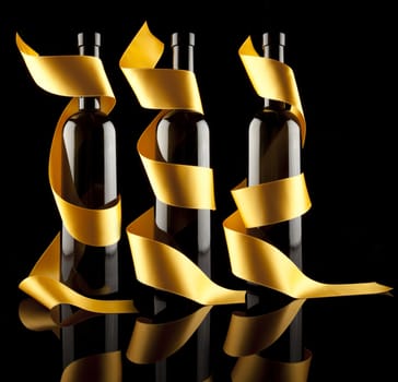 Gold ribbons aroun redwines bottles