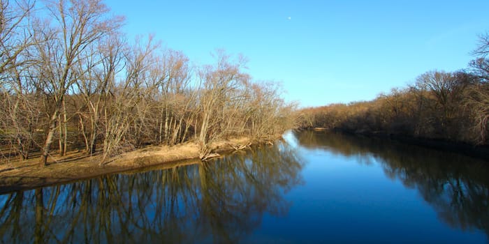 Trees reflect off the Kishwaukee river in northern Illinois.