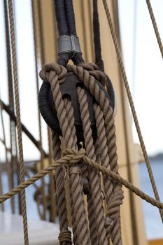 Old wooden block with rope. 