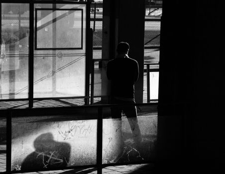 Man waiting for the bus an early morning at Slussen in Stockholm.