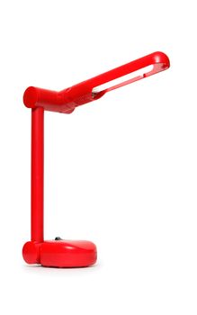 Nice modern red desk lamp isolated on white background with clipping path