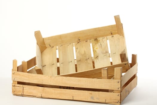 Two empty wooden crates over white background