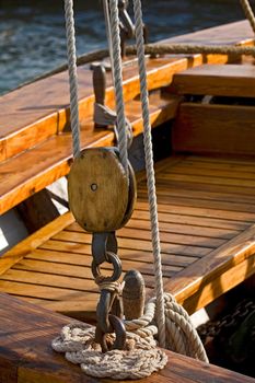 Old wooden block with rope. 
