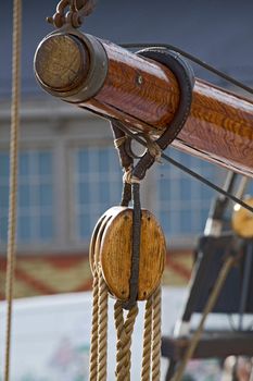 Old wooden block with rope. 