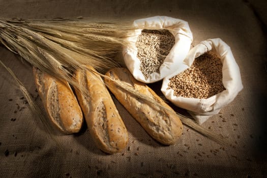 Wheat Bread and Wheat on wood