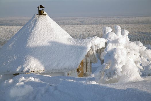 Cabin on winter landscape