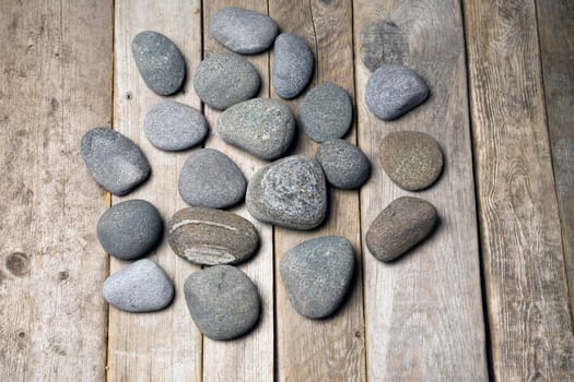 Stones on the old wood background