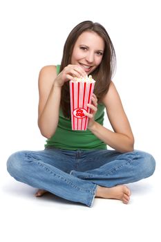 Pretty teen girl eating popcorn