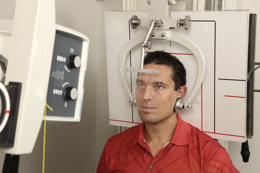 A patient getting his head x-rayed