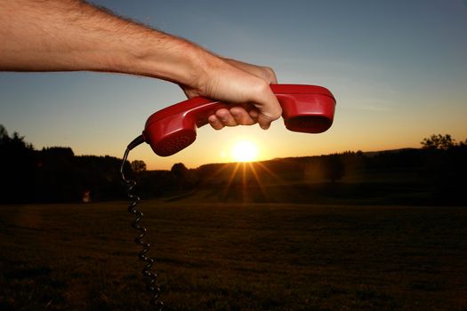 red phone in landscape