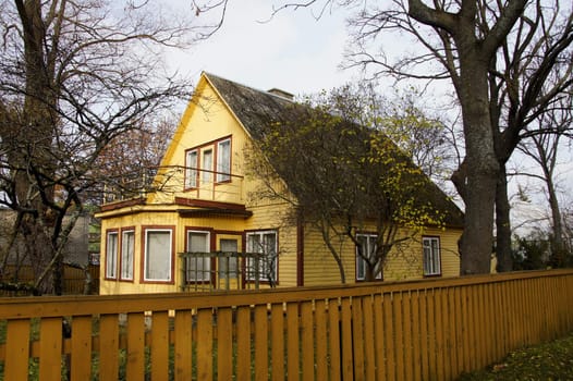 The modern wooden house and wooden fencing