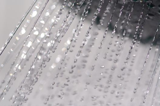 water drops falling from a shower indoors