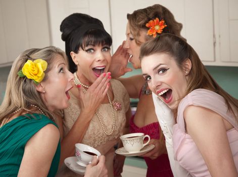 Group of four retro fashion housewives tell secrets in the kitchen