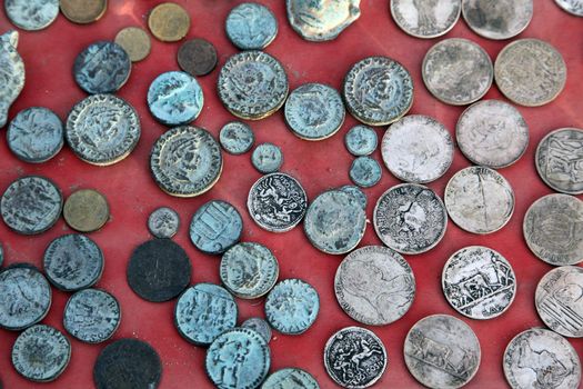 Wonderful collection of old coins from different countries, El-Jem market, Tunisia