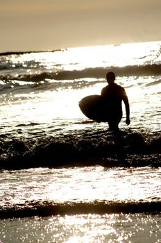 surfing at a nice beach outside at the sea