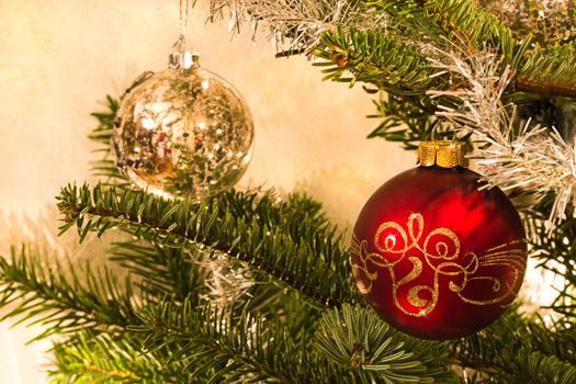 Red and silver balls in christmas tree - horizontal image