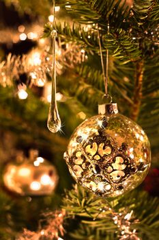 Christmas tree decoration in silver and glass with lights - vertical