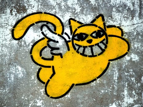 smiling cat paint on street wall