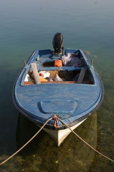 A wooden rowing boat tide down